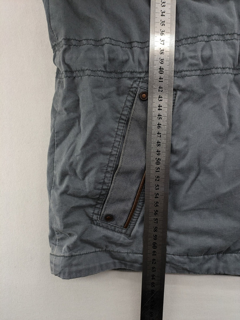 edc grey parka jacket with hood, adjustable drawstrings, and striped lining