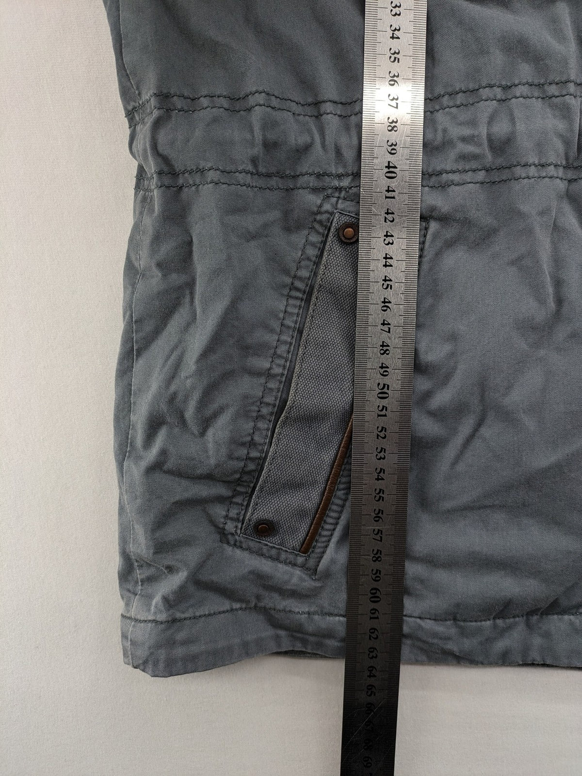 edc grey parka jacket with hood, adjustable drawstrings, and striped lining