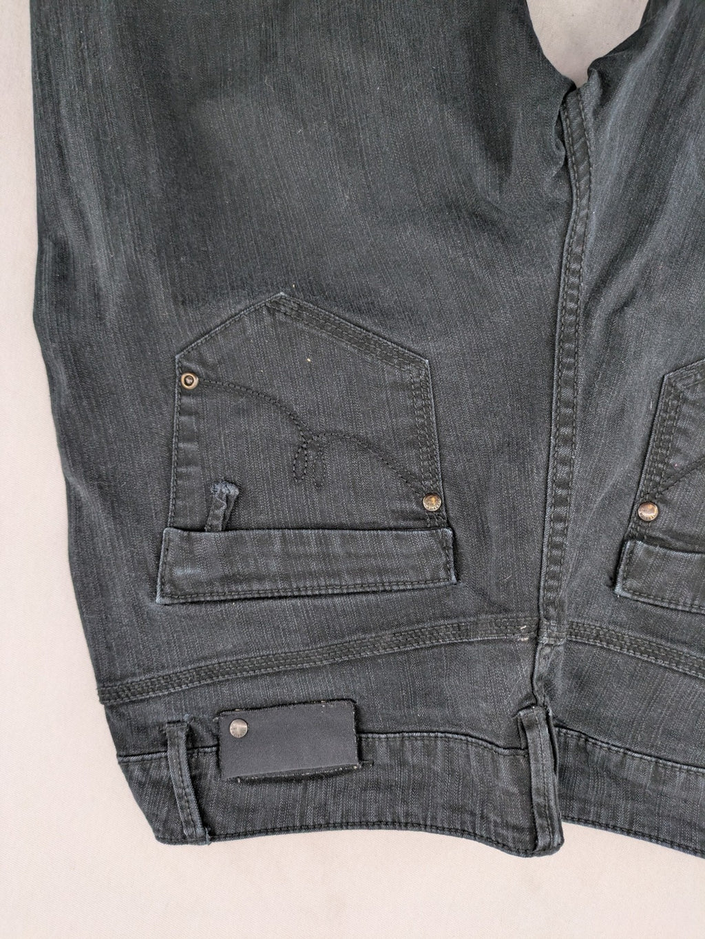 Yessica black straight jeans with classic dark wash and stretch denim material.