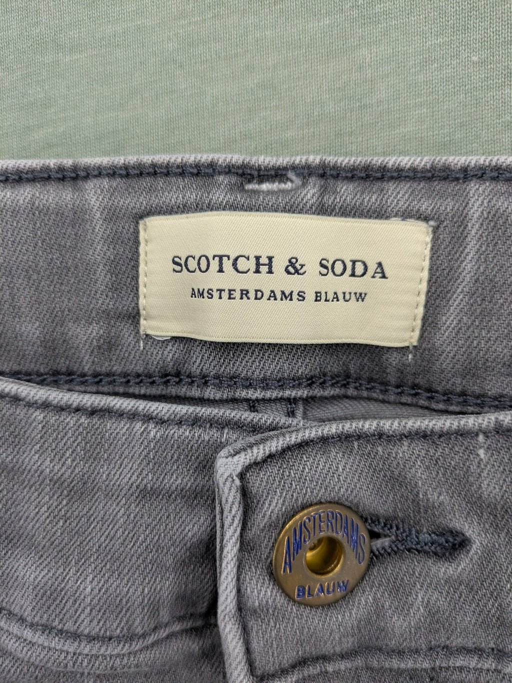 Scotch & Soda grey straight jeans with classic five-pocket design and logo patch.