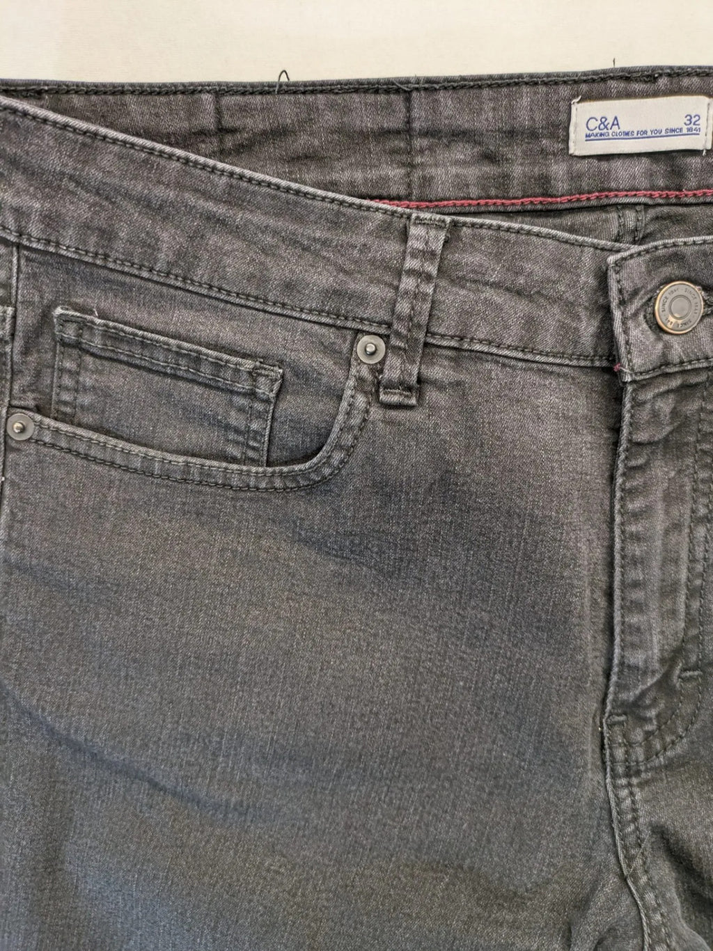 C&A grey straight jeans five-pocket design made from cotton blend with stretch.