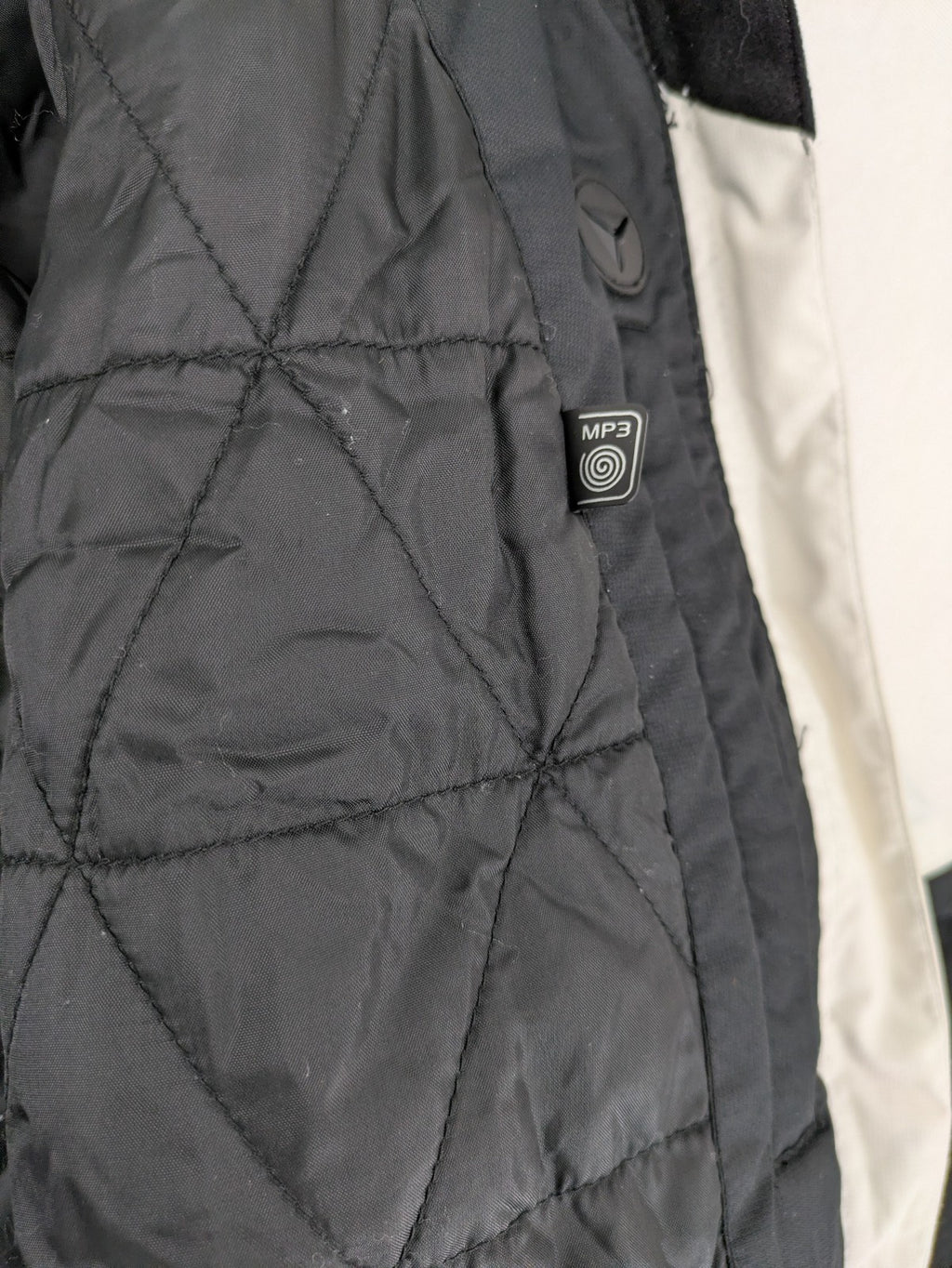 Icepeak black and white ski snowboard jacket with RECCO logo and quilted insulation.