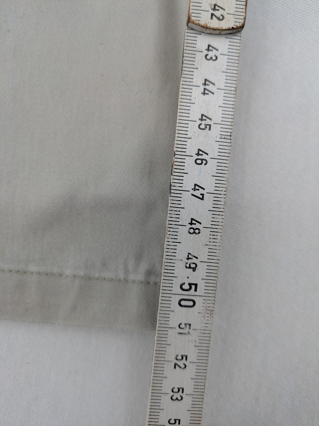 H&M L.O.G.G beige bootcut pants with double button closure and stretch cotton material.