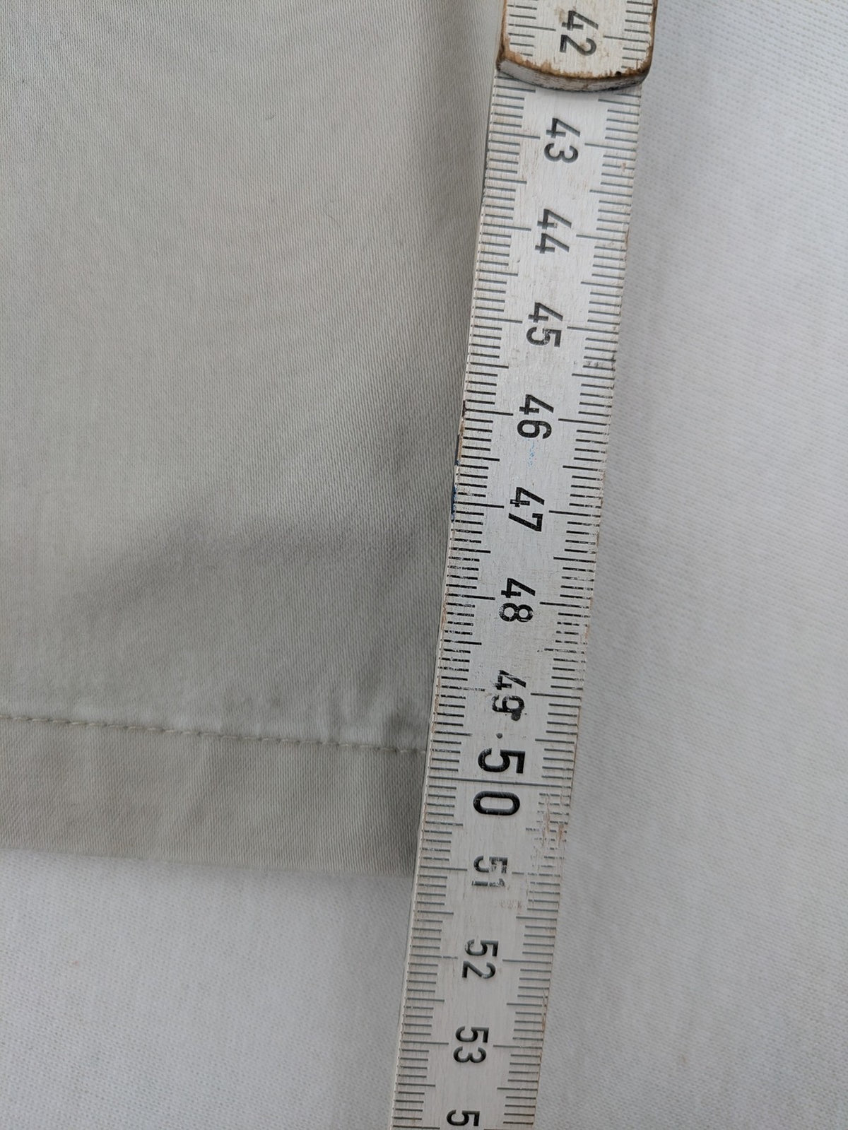 H&M L.O.G.G beige bootcut pants with double button closure and stretch cotton material.