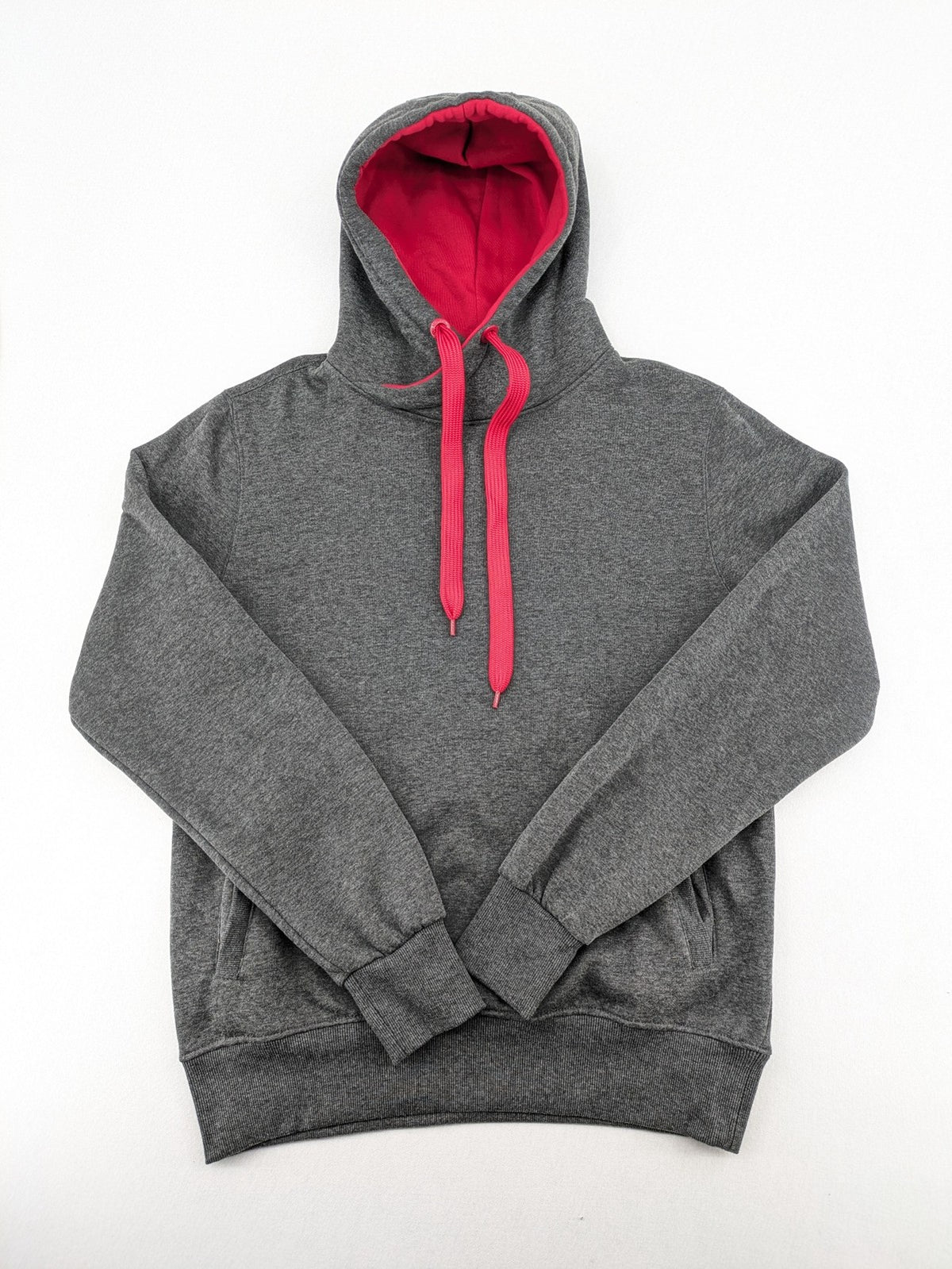 Bolf grey hoodie with pink contrast hood, kangaroo pocket, and ribbed cuffs.