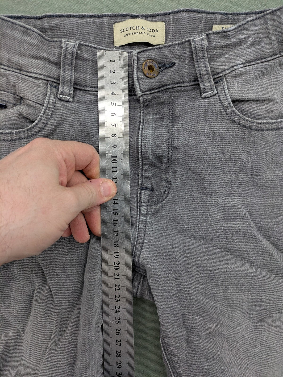 Scotch & Soda grey straight jeans with classic five-pocket design and logo patch.