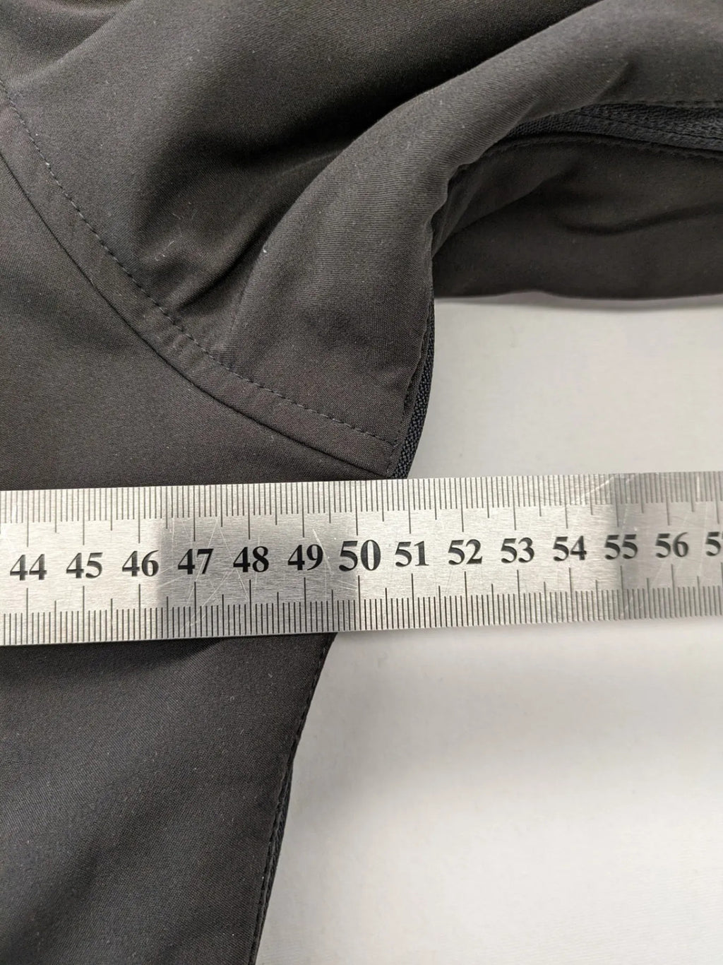 James & Nicholson grey softshell jacket with fleece lining and multiple zip pockets.