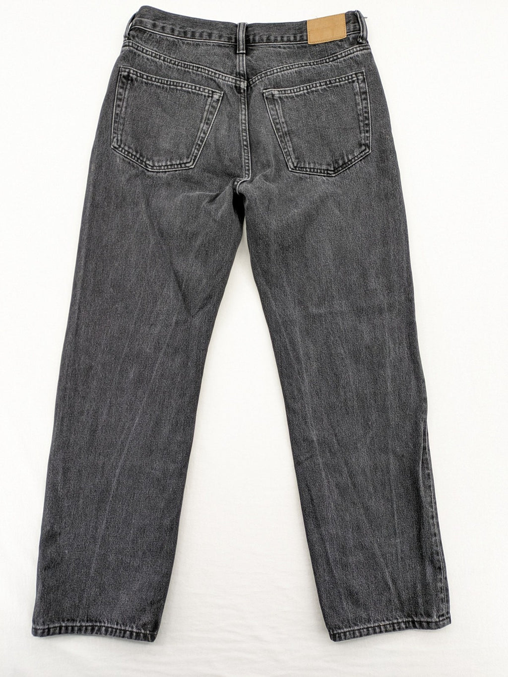 Weekday grey straight jeans with button fly and classic denim design.