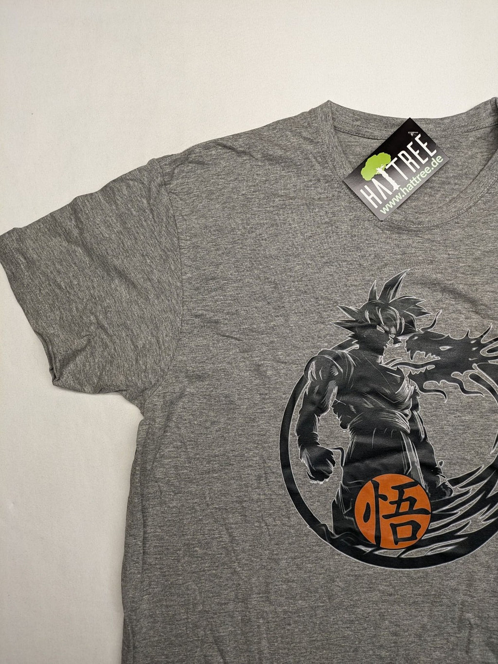 Dragon Ball Z grey t-shirt featuring Son Goku graphic print and "Go" Kanji symbol.