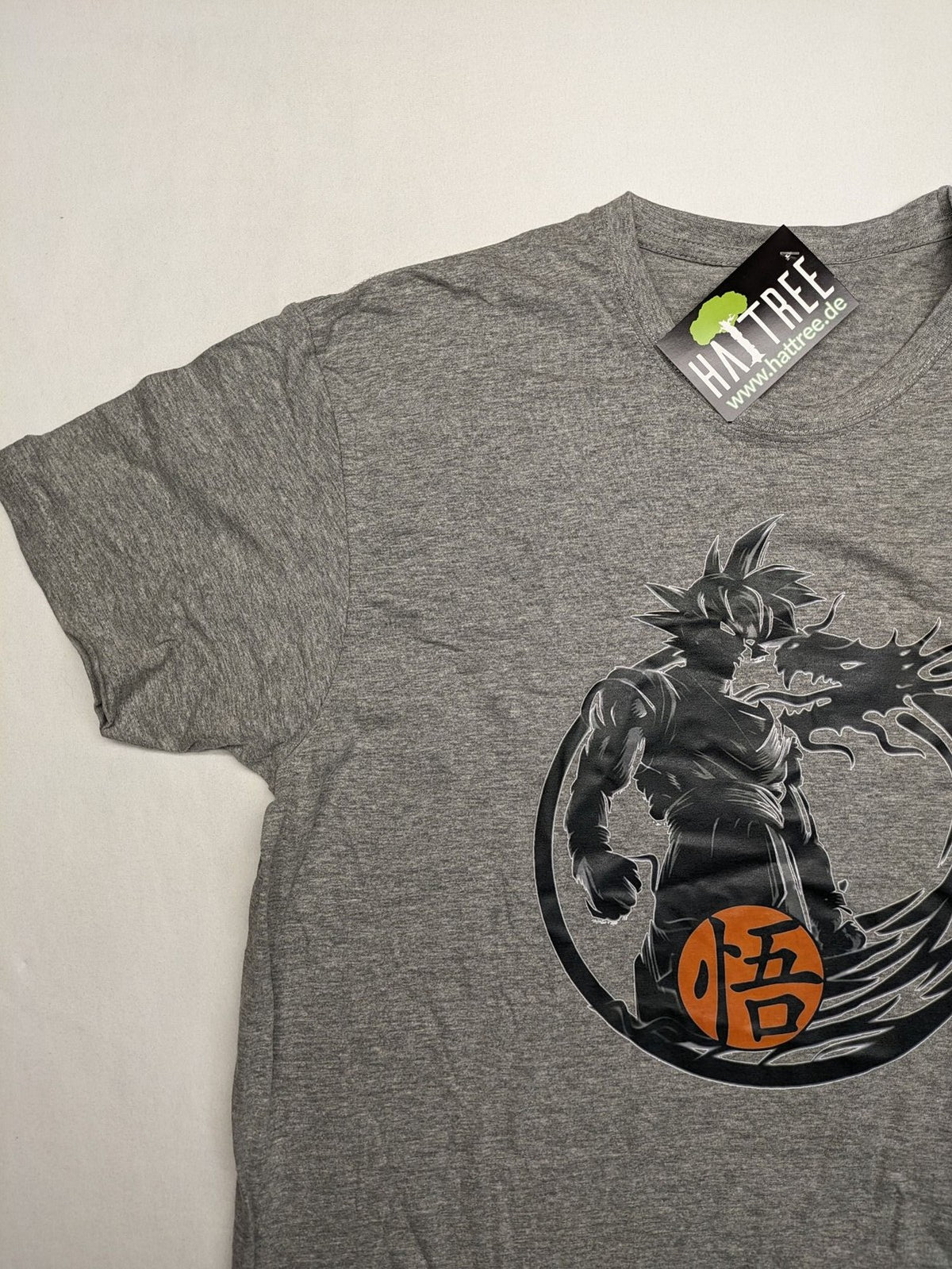 Dragon Ball Z grey t-shirt featuring Son Goku graphic print and "Go" Kanji symbol.