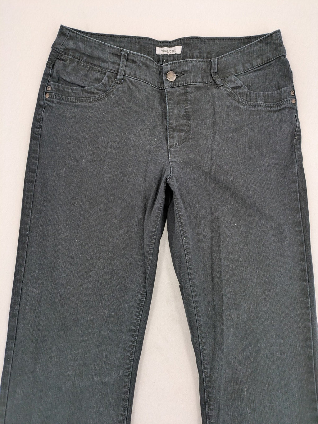 Yessica black straight jeans with classic dark wash and stretch denim material.