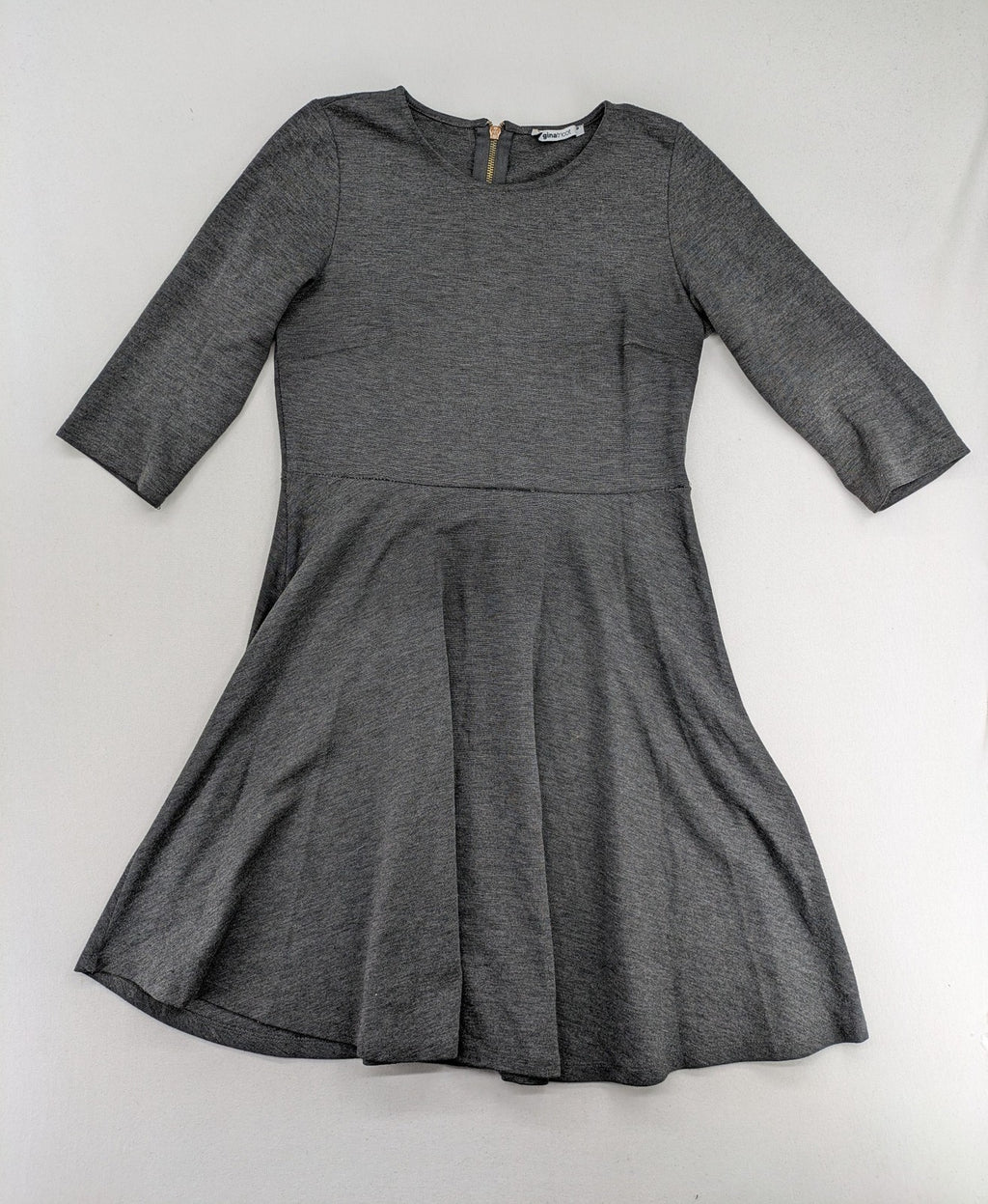Ginatricot grey A-line skater dress with 3/4 sleeves and visible back zipper.