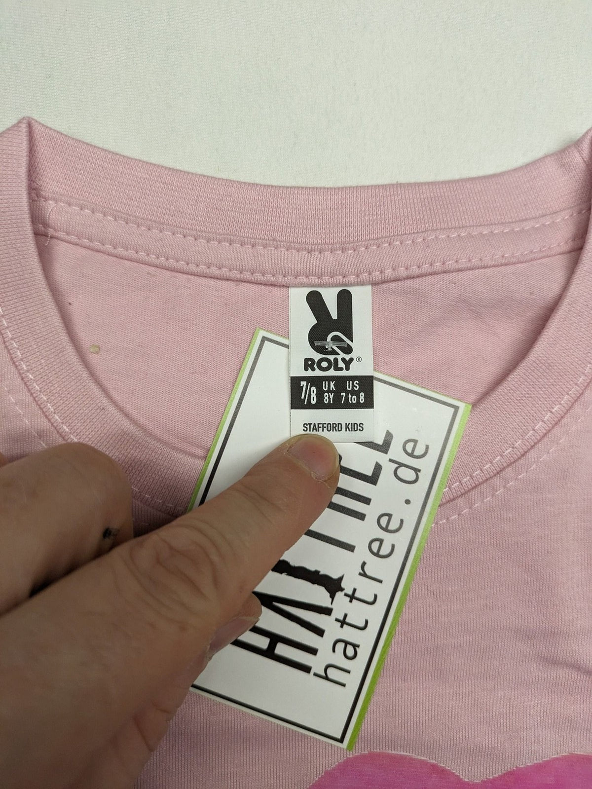 Hello Kitty multi T-shirt pink with large strawberry graphic and short sleeves.