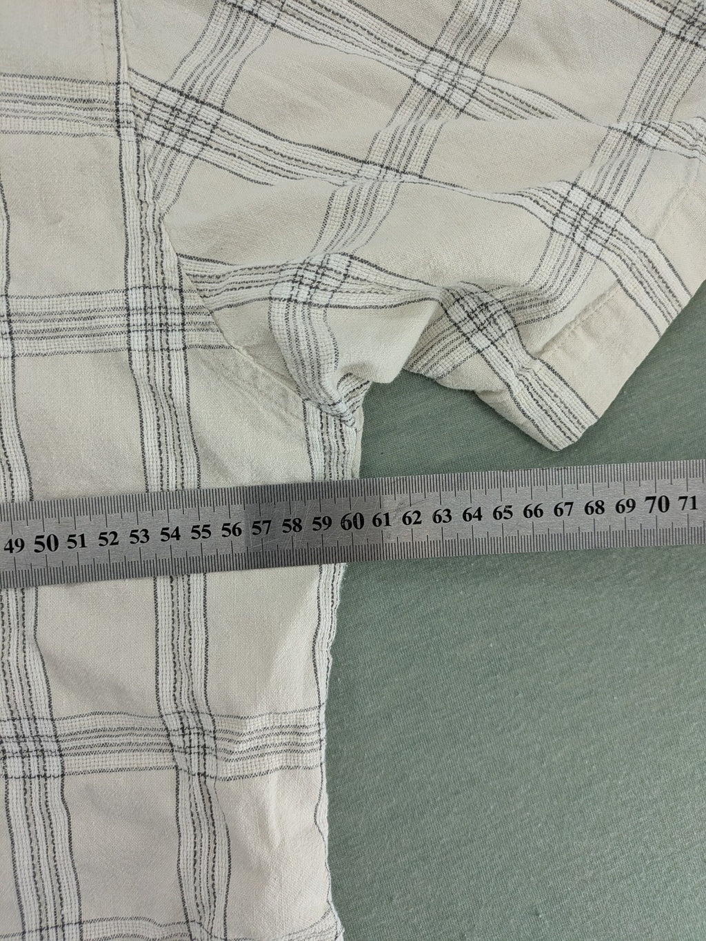 Ken Baker short-sleeve button-down shirt beige blue check pattern with single chest pocket.