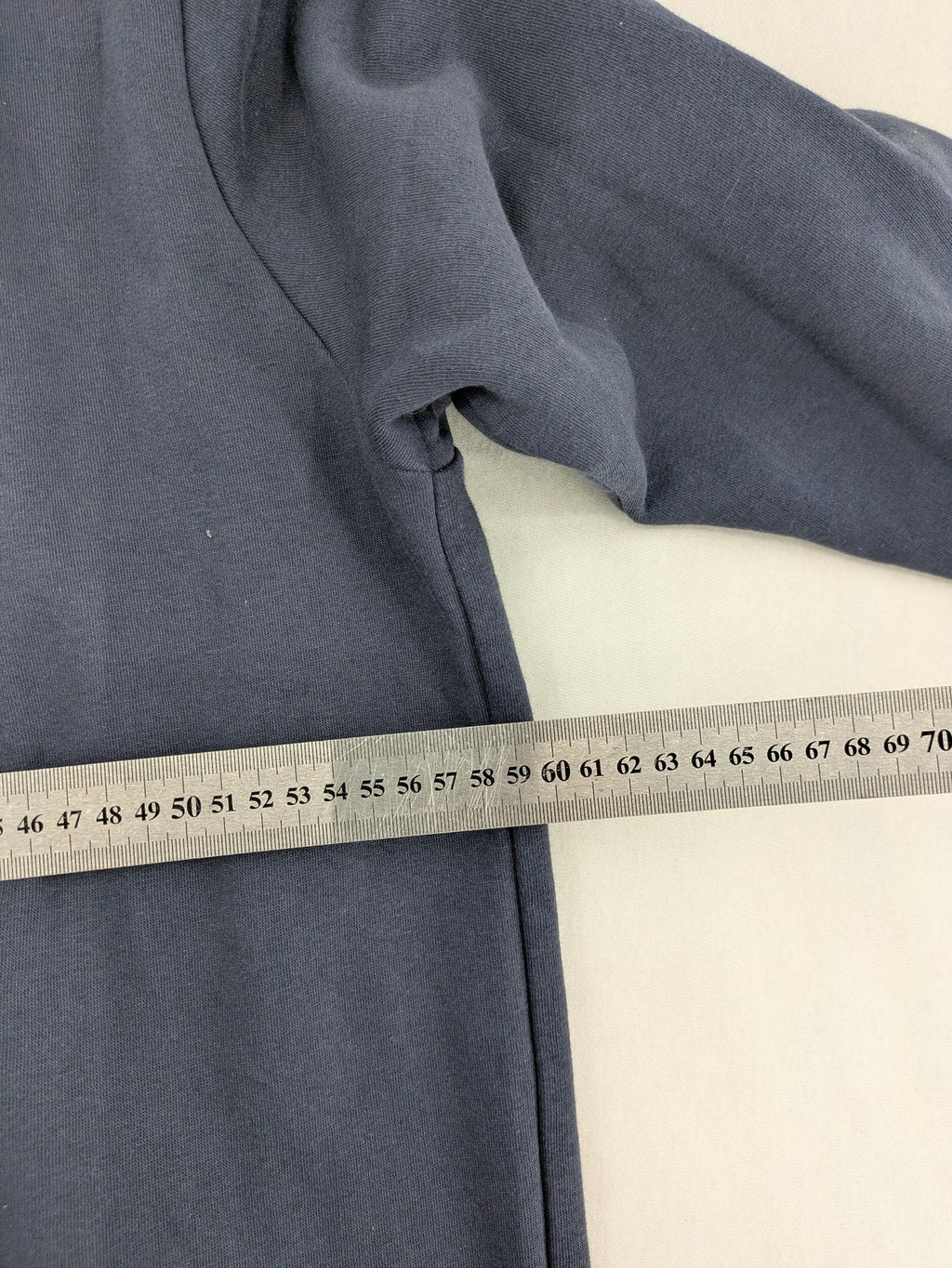G-Unit navy turtle neck jumper with vertical logo graphic and soft fleece interior.
