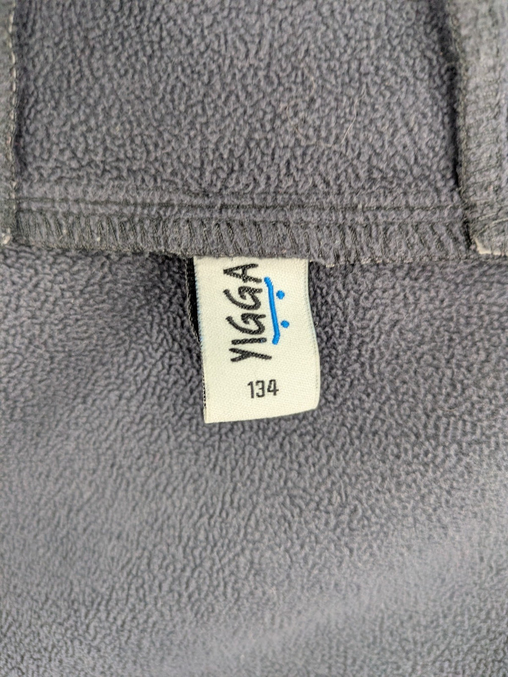 Yigga grey softshell coat with fleece lining, hood, and reflective details.