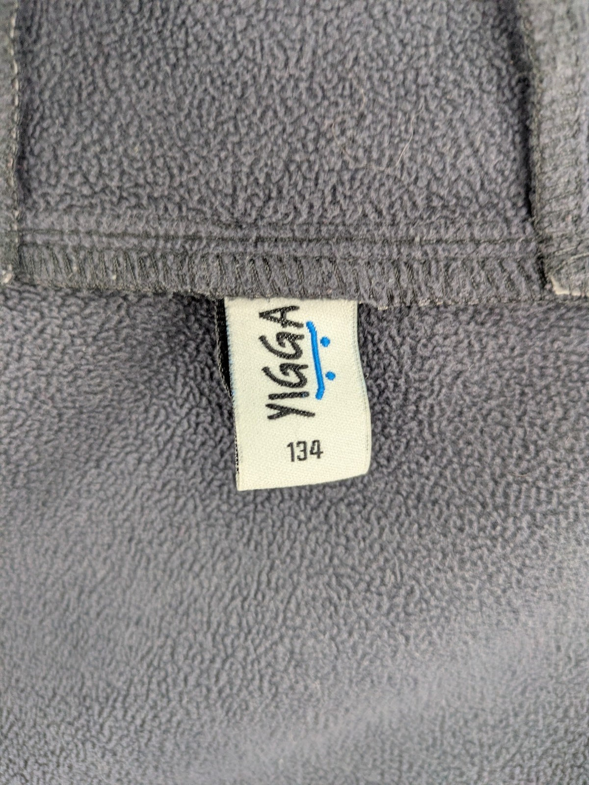Yigga grey softshell coat with fleece lining, hood, and reflective details.