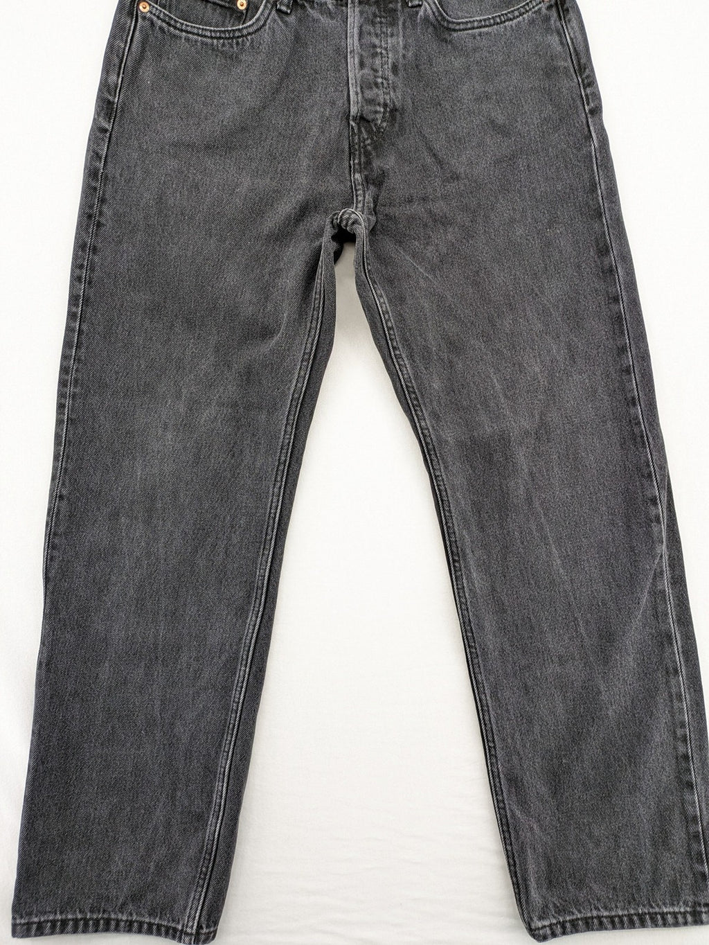 Weekday grey straight jeans with button fly and classic denim design.