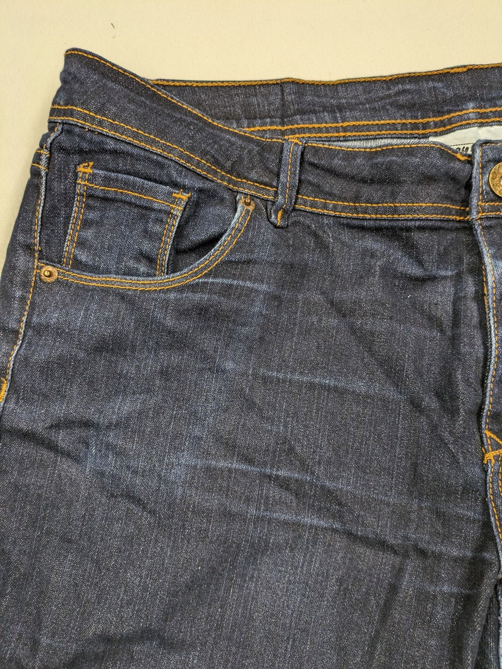 Okay blue straight jeans dark wash 5-pocket style with stretch material for comfort.