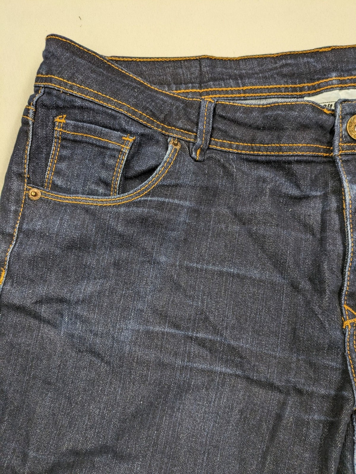 Okay blue straight jeans dark wash 5-pocket style with stretch material for comfort.