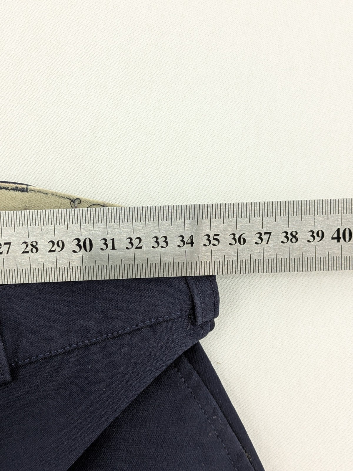 H&KM beige riding pants with dark blue full seat and front zippers.