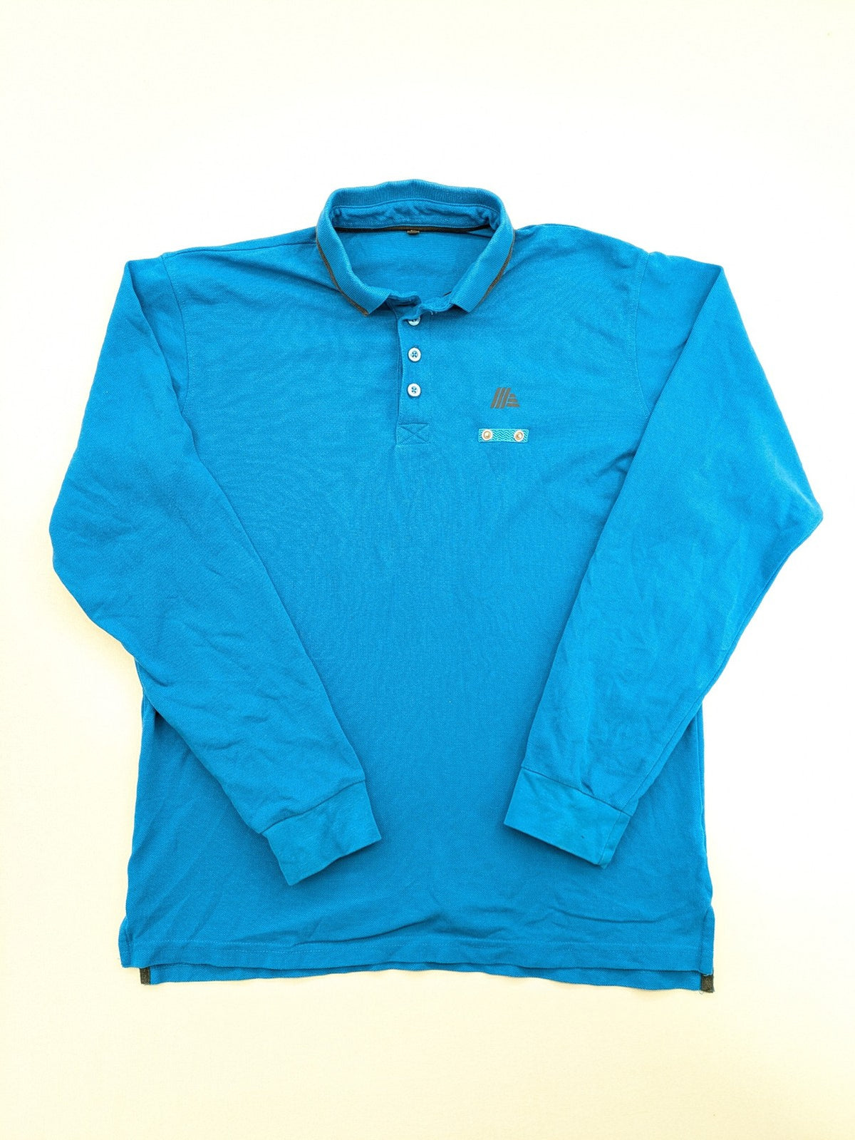 Aldi blue long sleeve polo shirt with embroidered logo and classic collar.