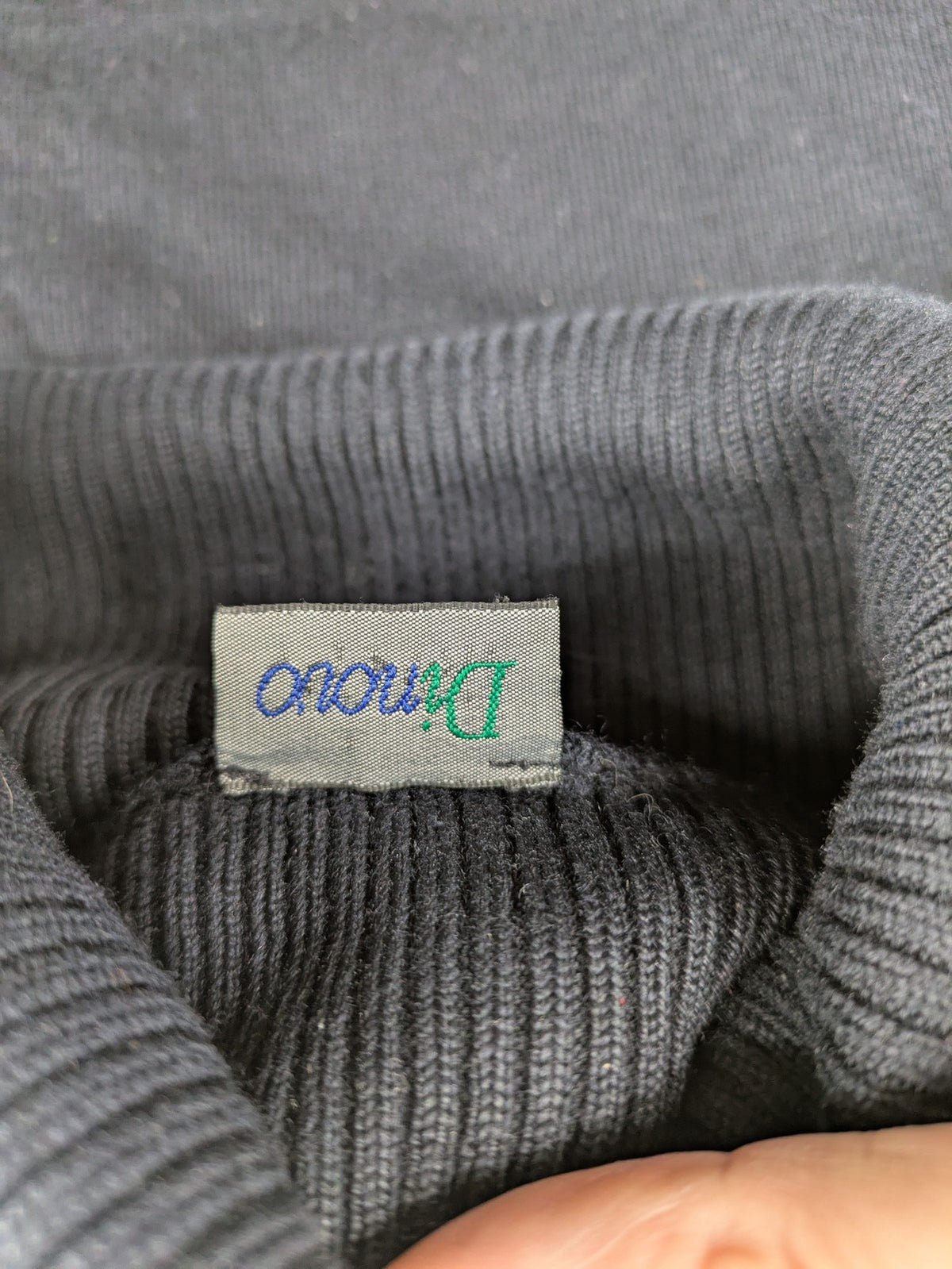 Dinovo grey knit jumper with ribbed roll neck and cuffs, made from merino wool blend.