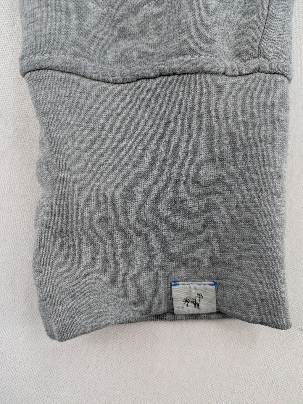 Private Baller grey sweatpants with "32" graphic print and blue drawstring.