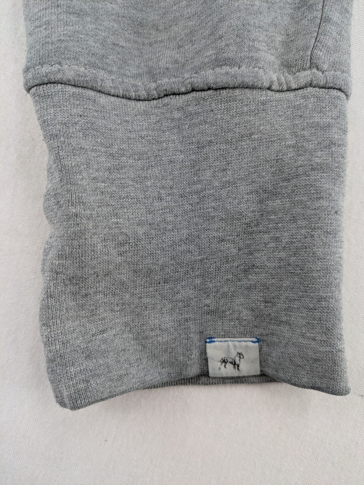 Private Baller grey sweatpants with "32" graphic print and blue drawstring.