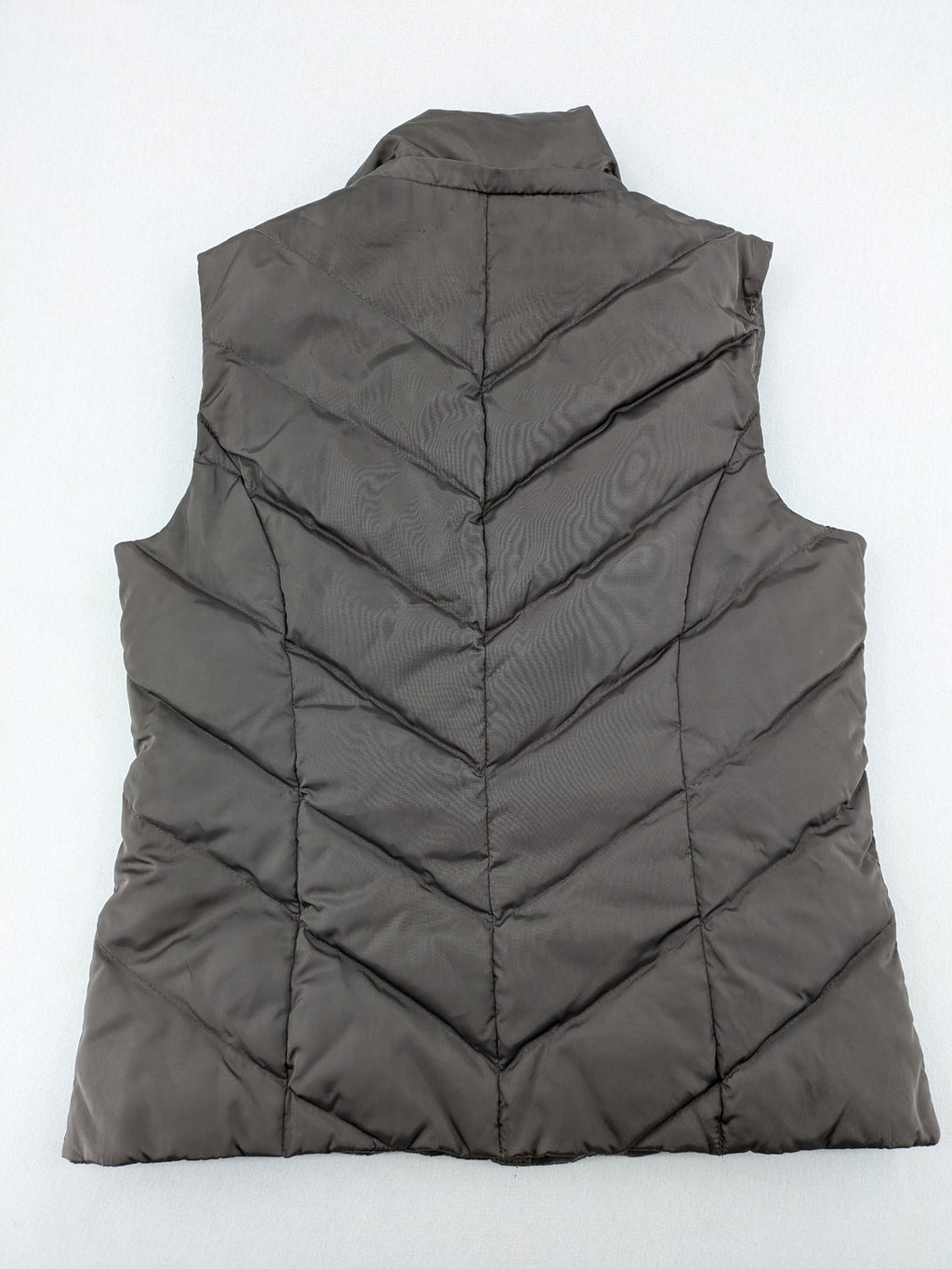 L&A Fashion grey puffer vest with zip closure, stand collar, and side pockets.