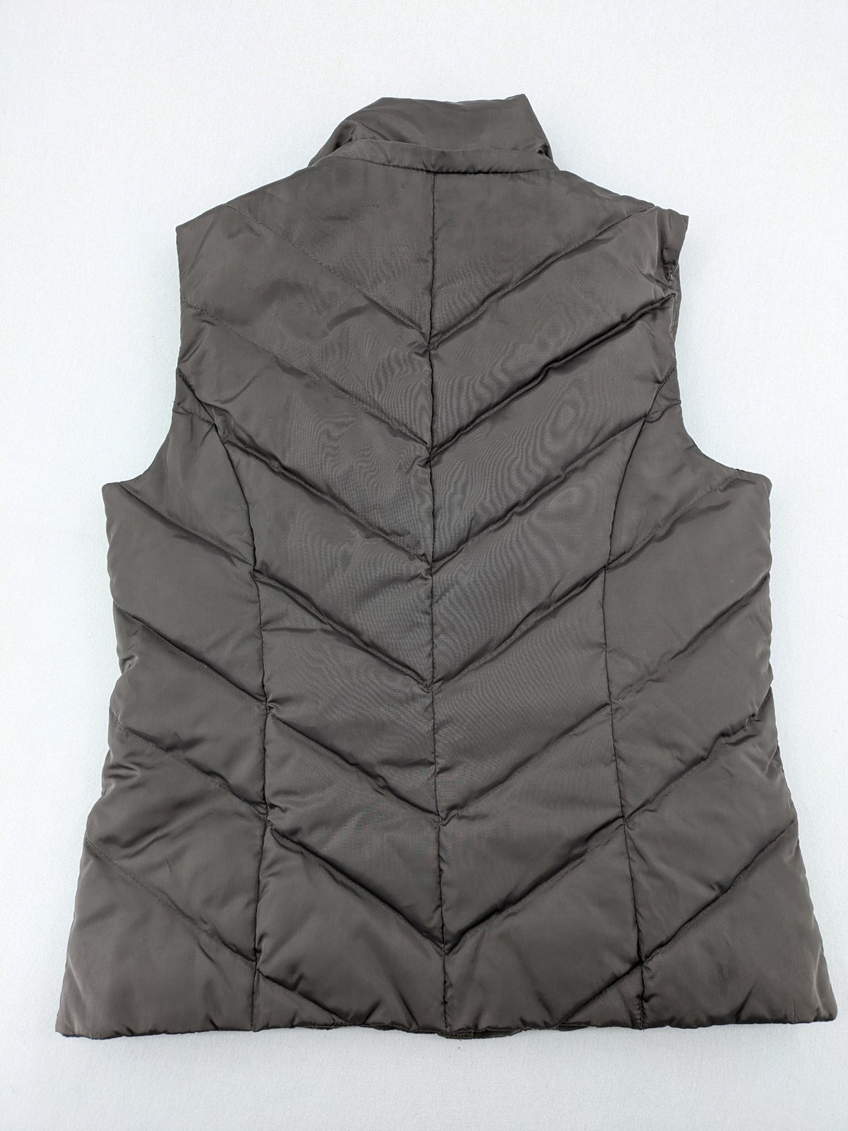 L&A Fashion grey puffer vest with zip closure, stand collar, and side pockets.