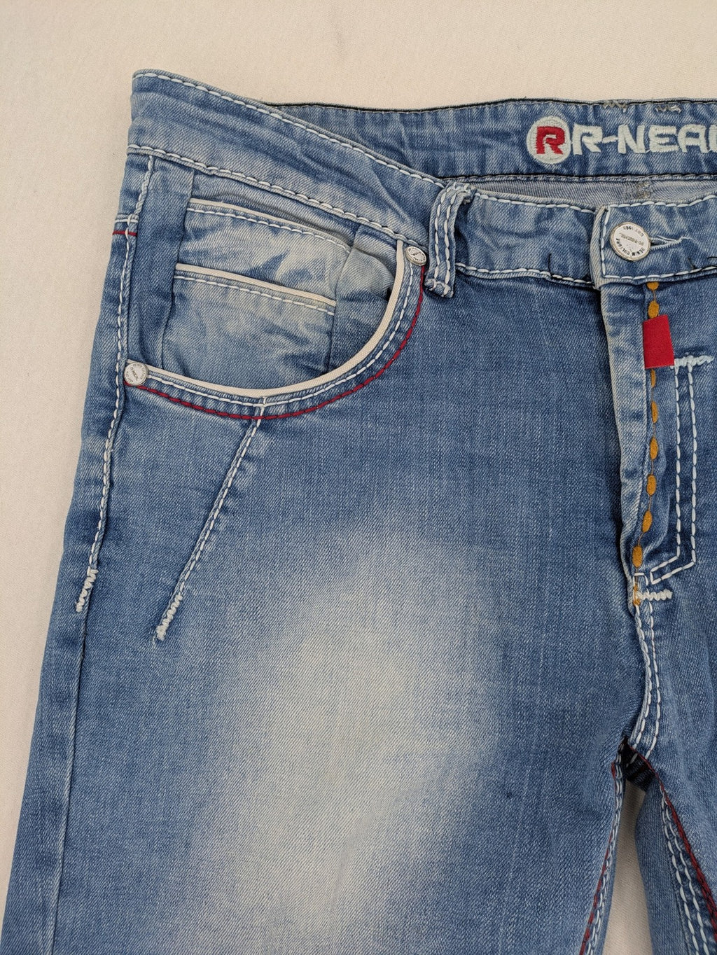 R-Neal blue straight jeans with red-white contrast stitching and classic 5-pocket design.