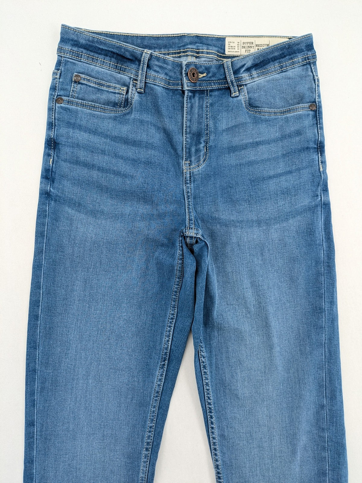 ESMARA blue super skinny jeans with medium waist and stretchy cotton blend material.