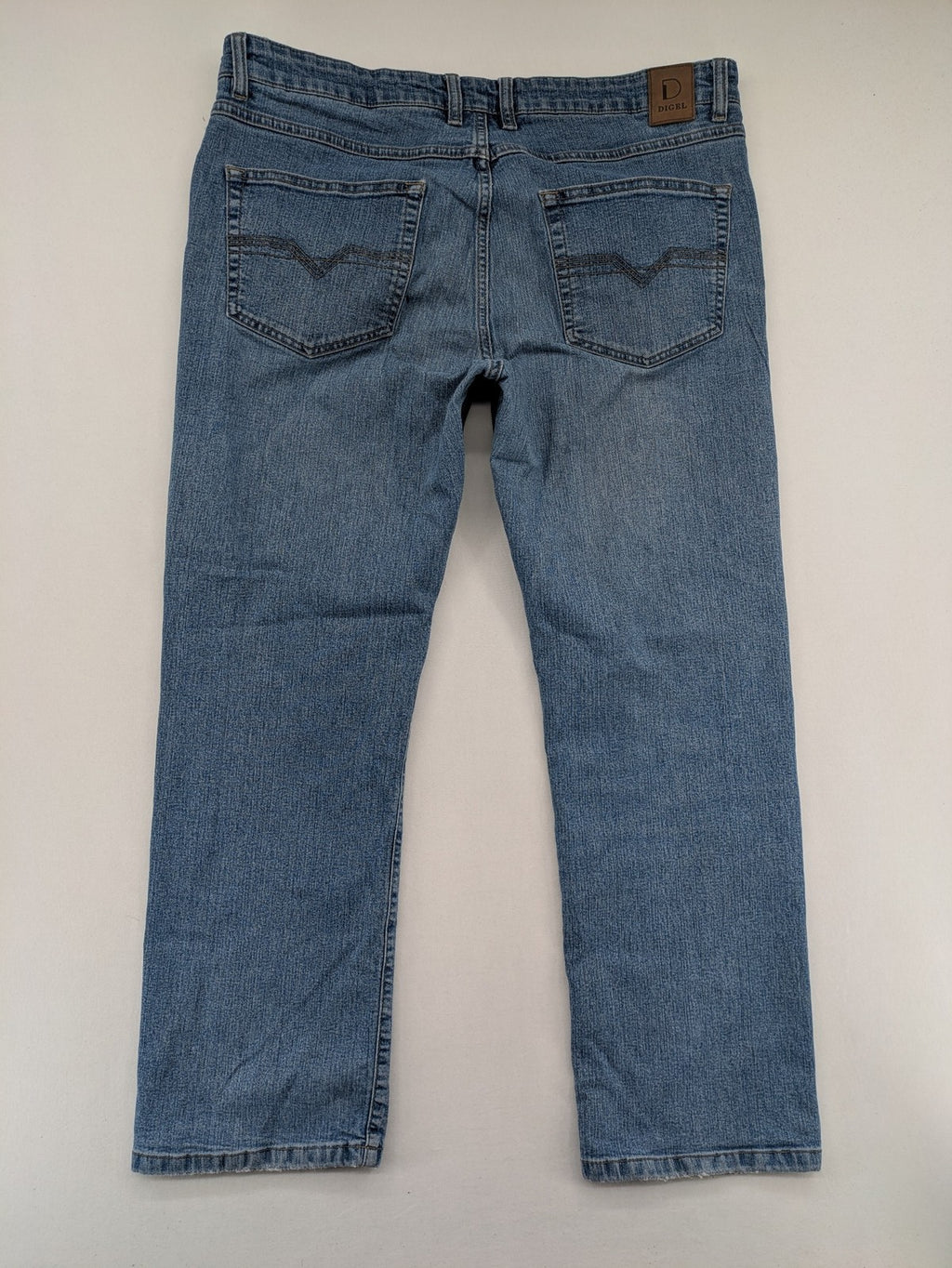Digel blue straight jeans with classic medium wash and durable cotton denim material.