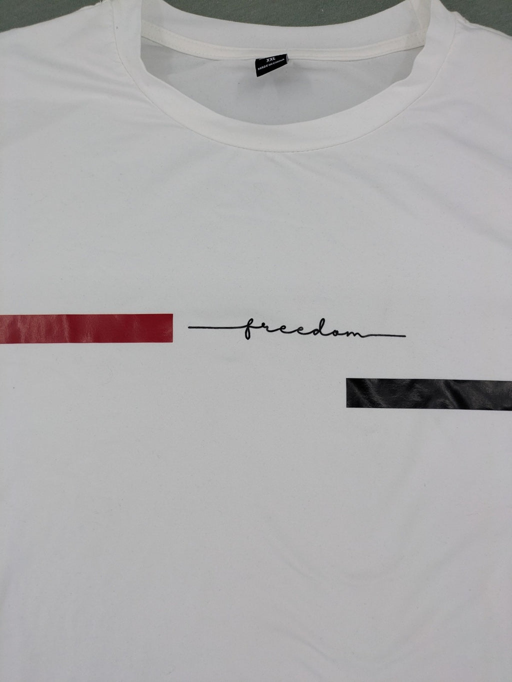 Manfinity black and white outfit set with red accents and "Freedom" graphic print.