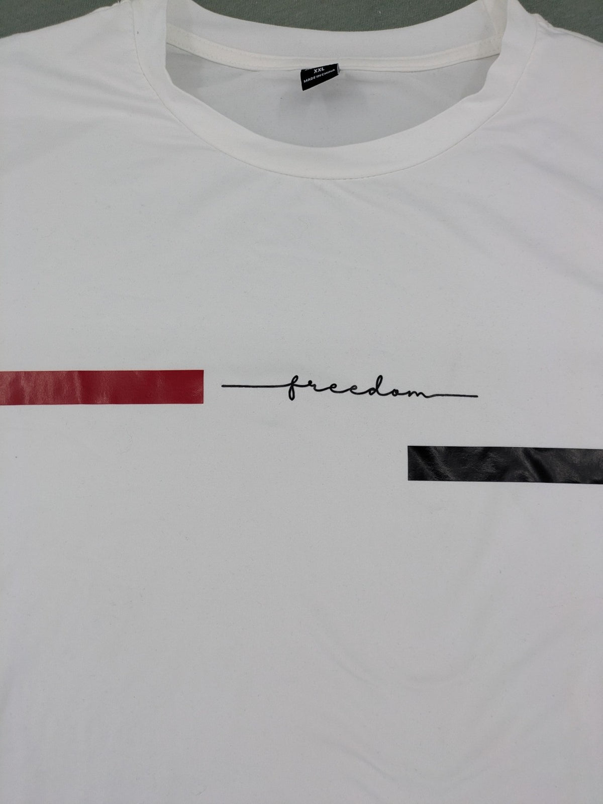 Manfinity black and white outfit set with red accents and "Freedom" graphic print.