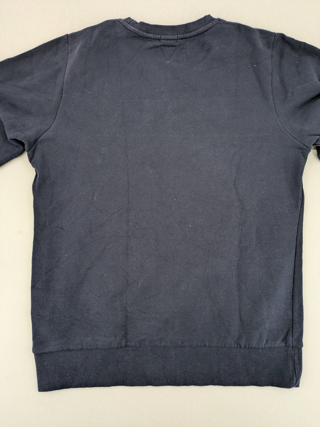 Superdry navy sweatshirt with embroidered tiger graphic and "JPN 54" chenille detail.