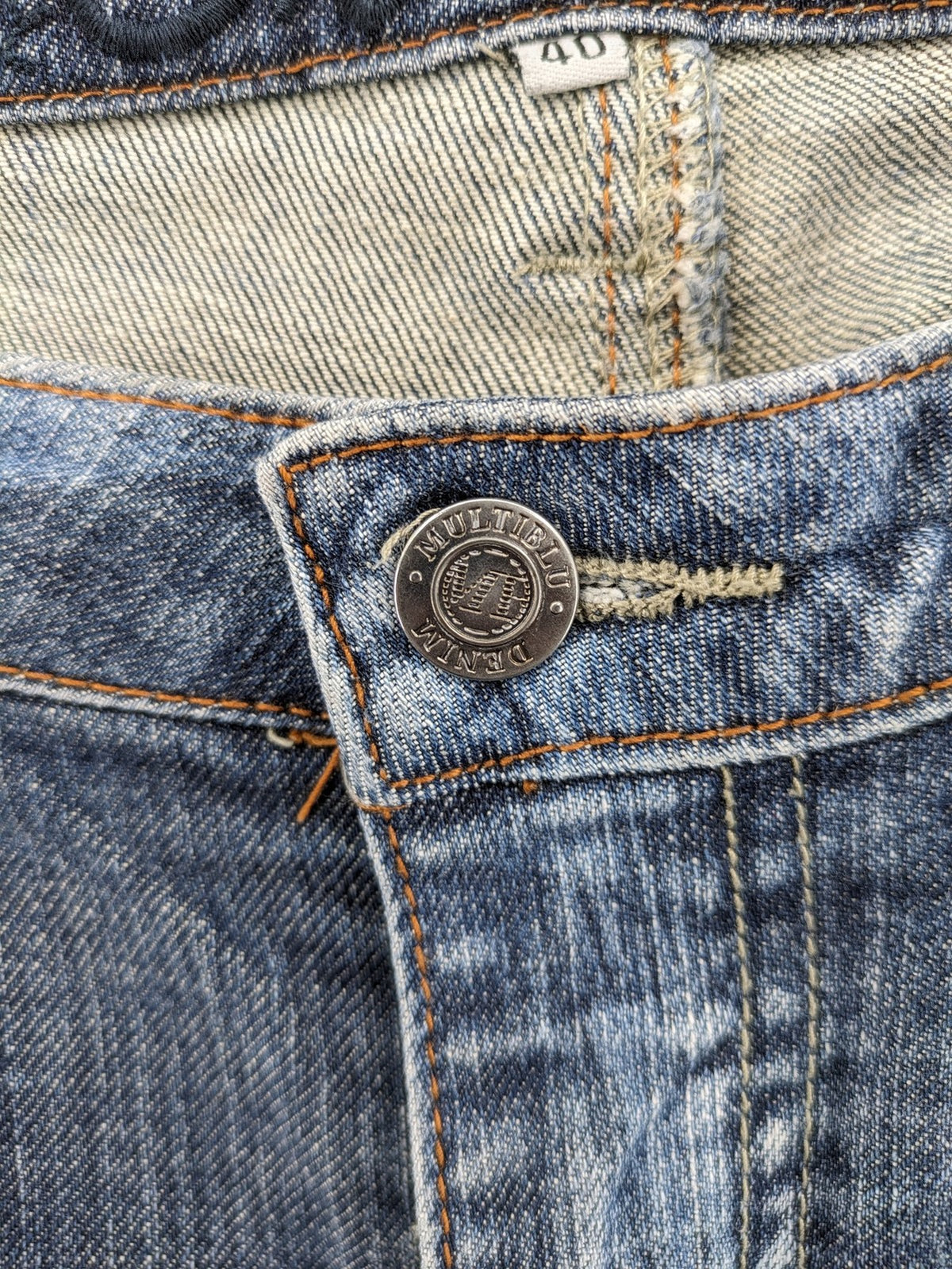 BLU blue straight jeans with washed effect, rolled hem, and five-pocket design.
