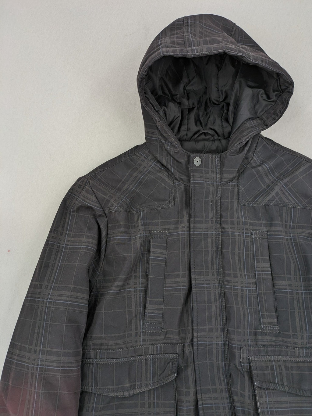 Jack & Jones grey checkered winter jacket with hood, quilted lining, and zip closure.