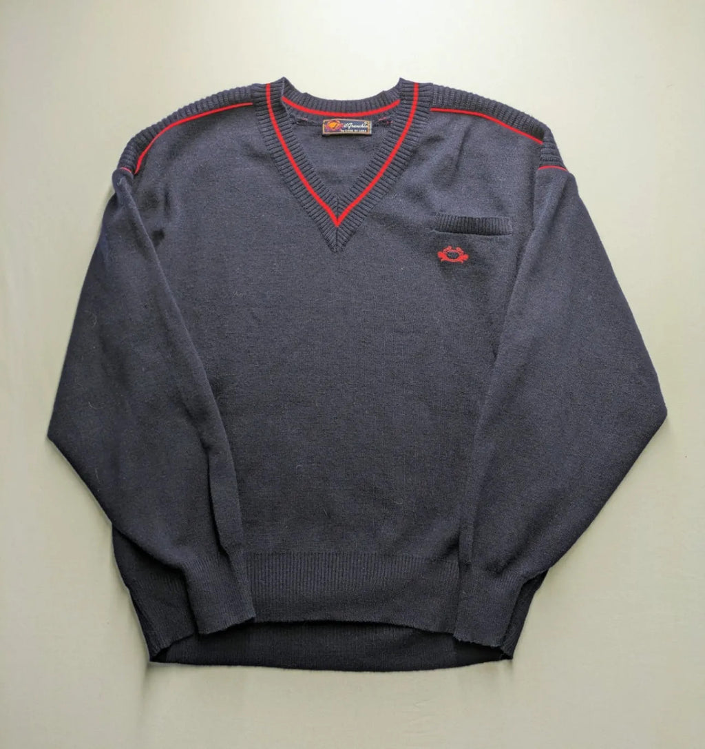 Il Granchio grey turtle neck jumper with red accents and embroidered crab logo.