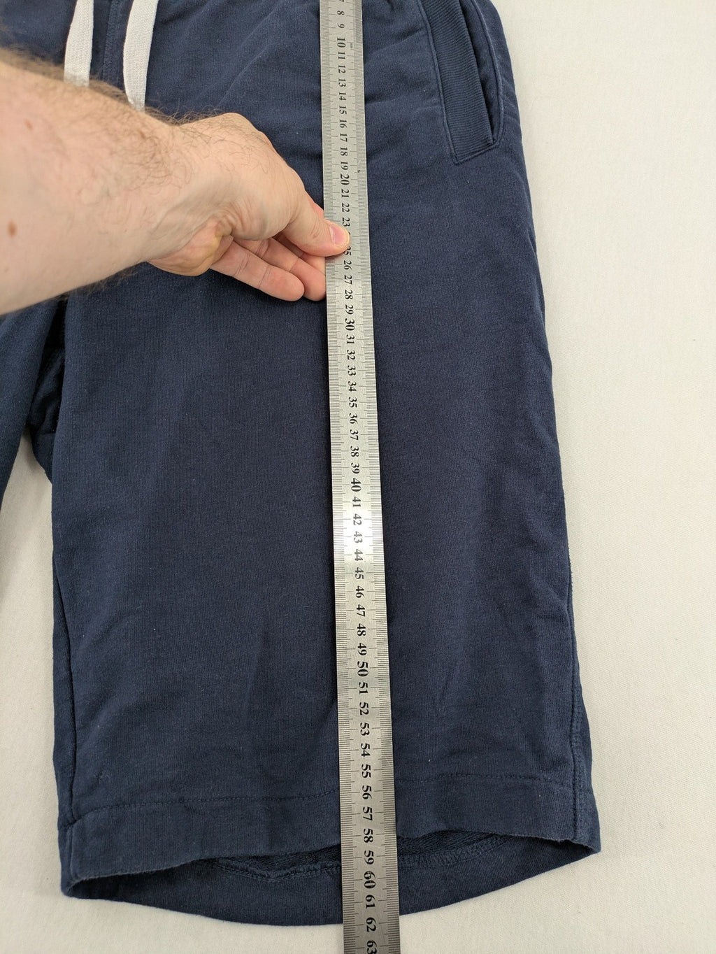 Livergy blue sweatshorts with "Northeast Sailors" graphic print and elastic waistband.