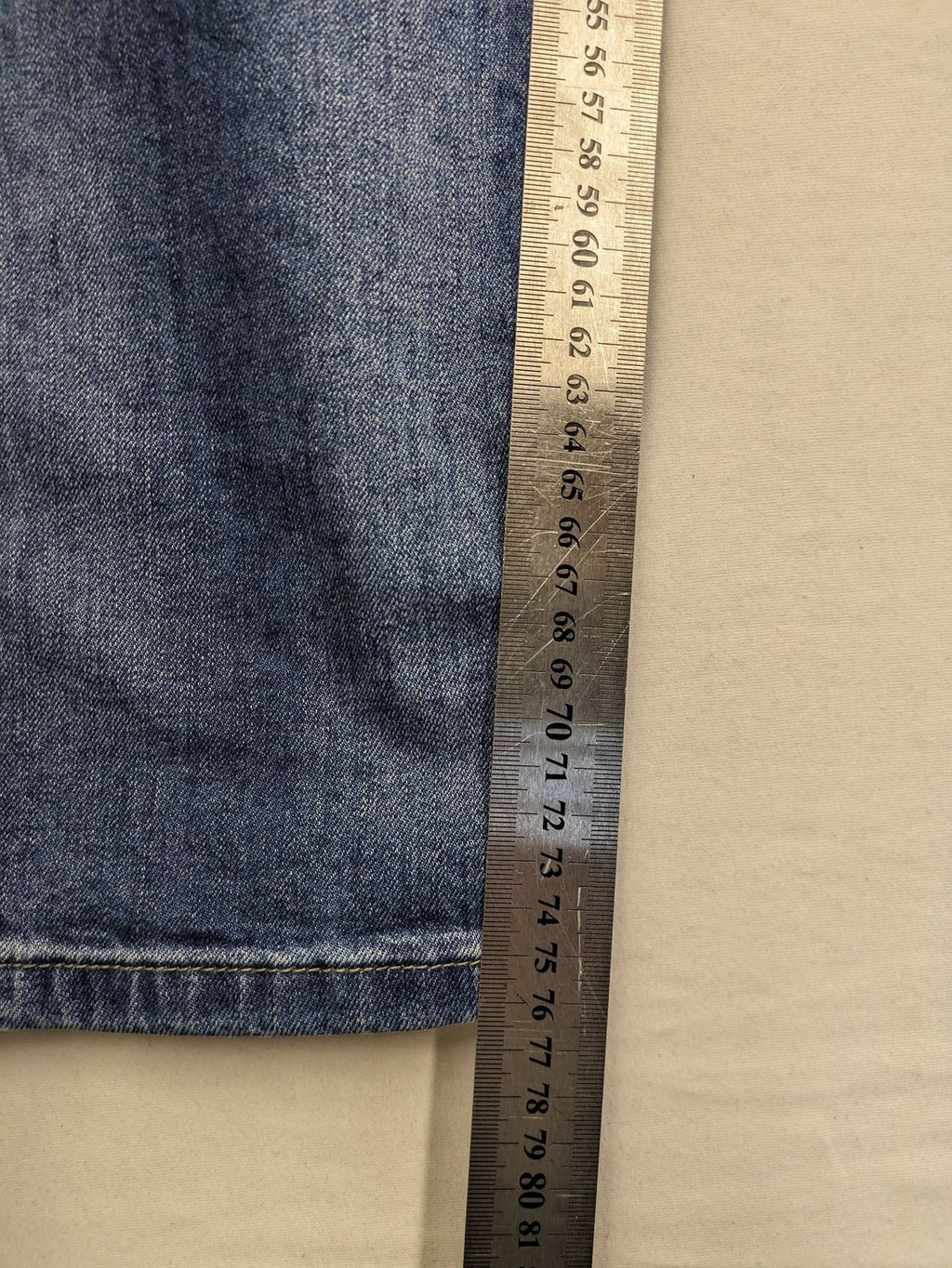 Brandit blue straight jeans with distressed details, button fly, and classic 5-pocket style.