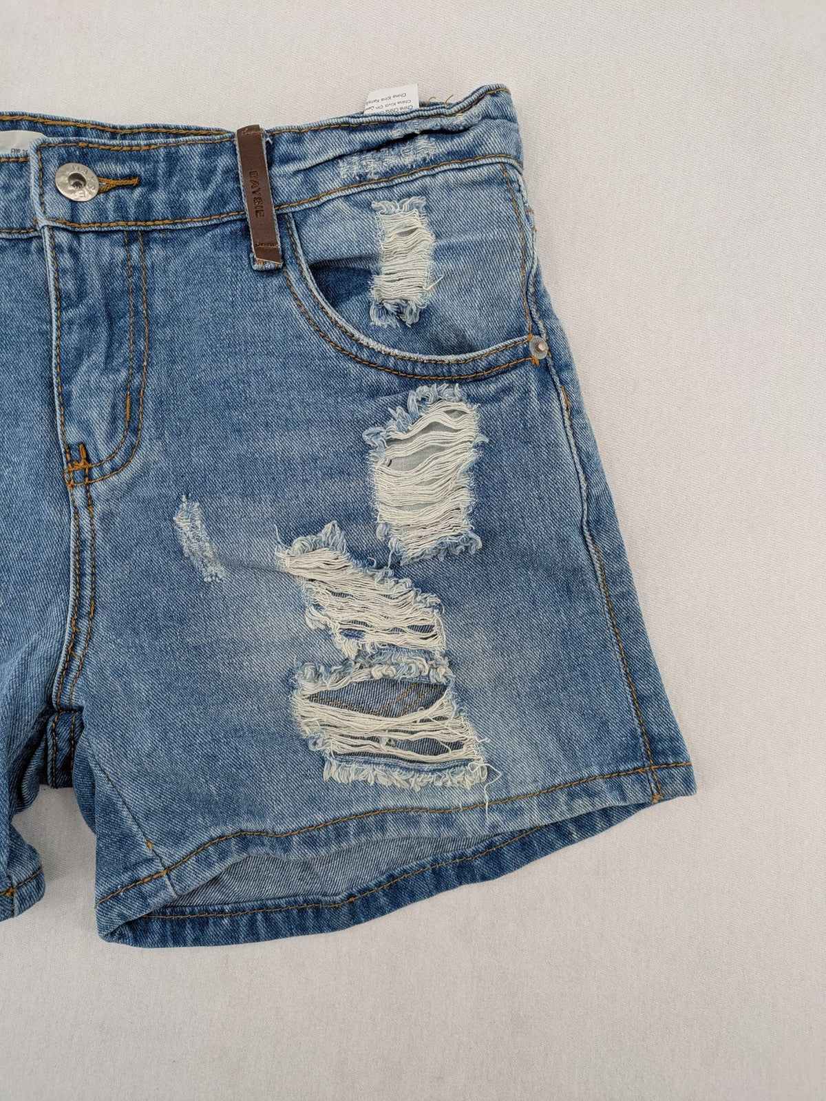 Daysie blue boyfriend jeans shorts with distressed rips and classic 5-pocket design.