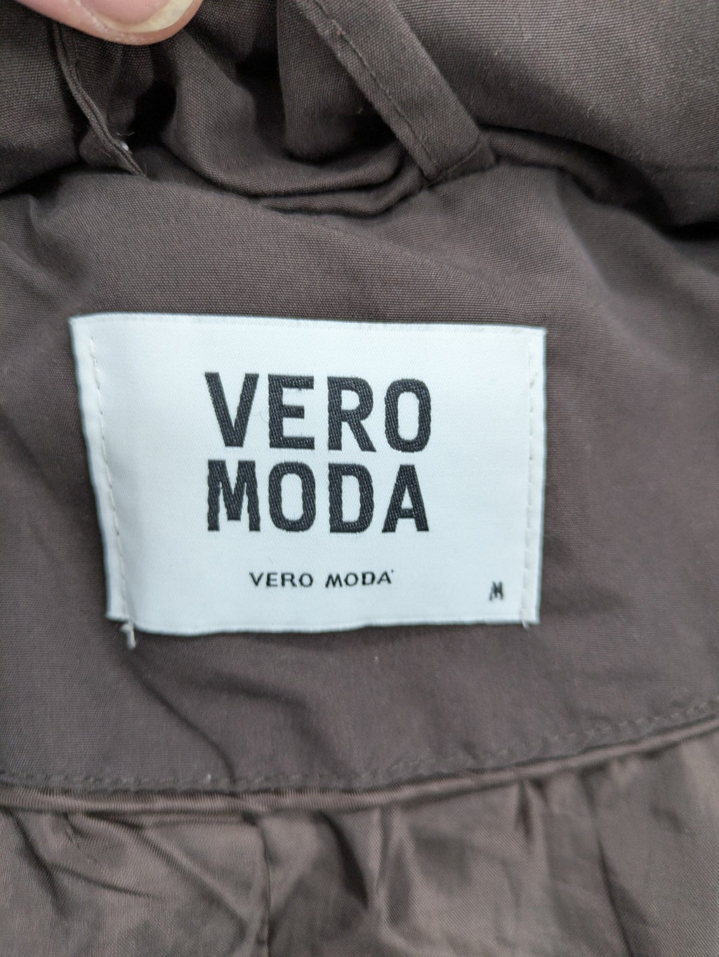 Vero Moda grey quilted jacket with high funnel neck and zippered pockets.