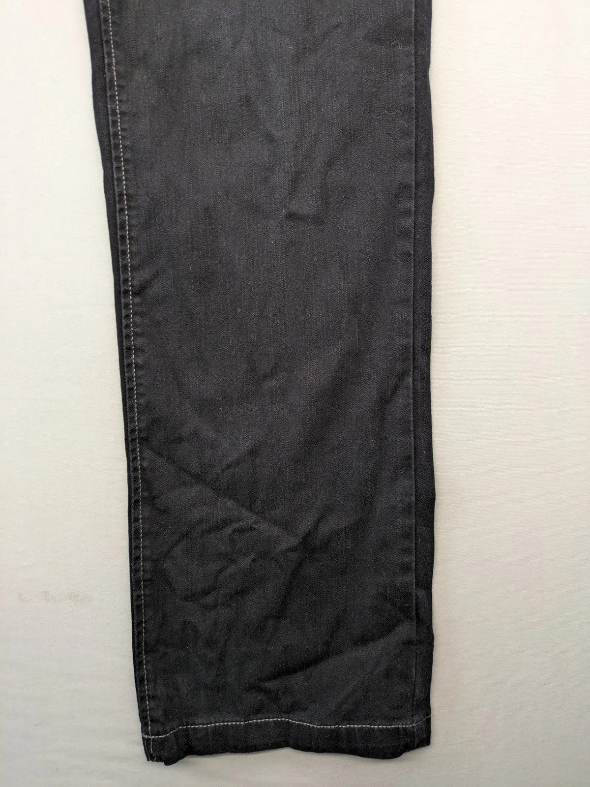 Okay grey straight jeans with contrast stitching and three-button closure, cotton stretch material.