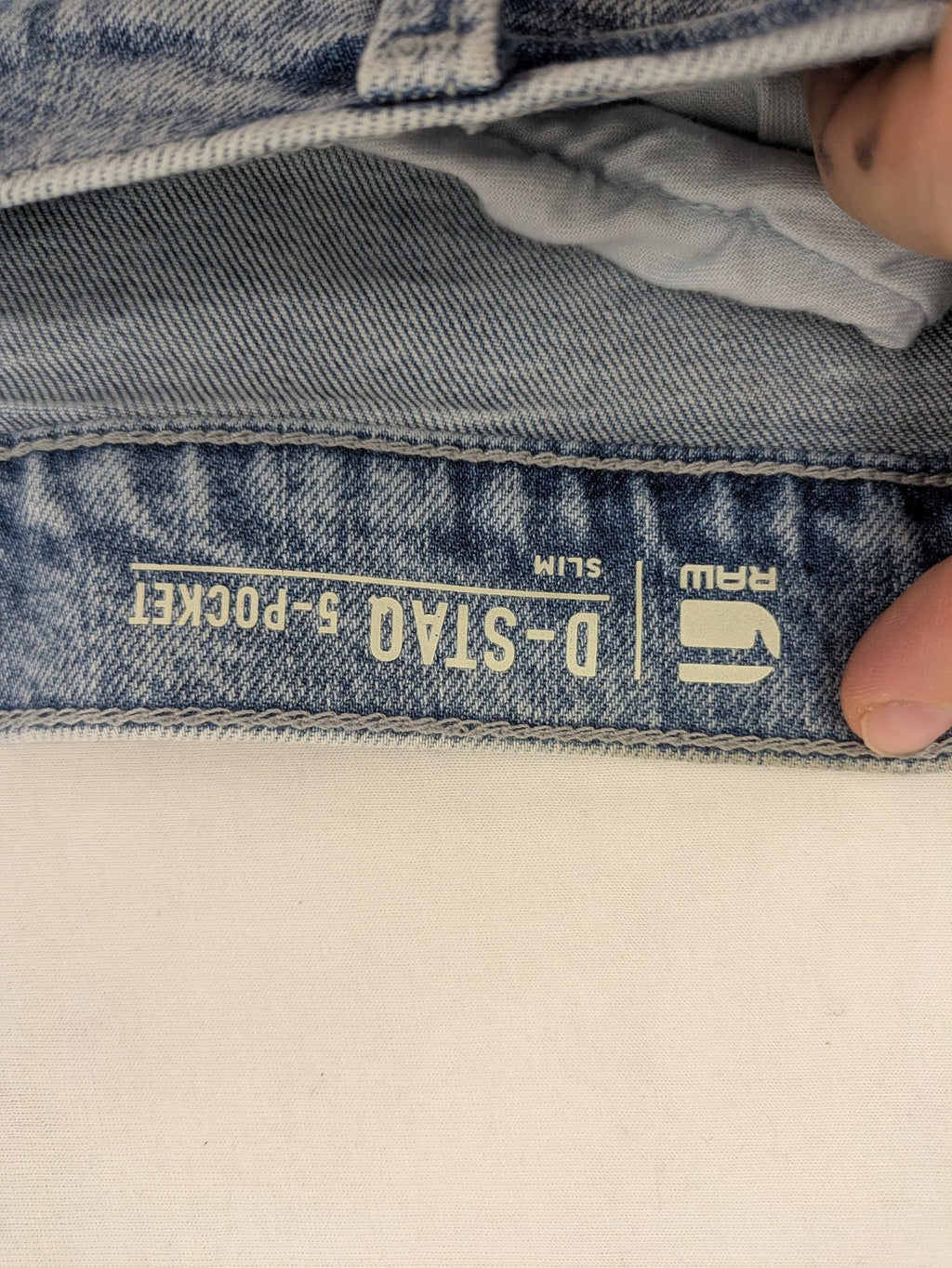 G-Star Raw blue slim fit jeans with 5-pocket design and light wash denim.