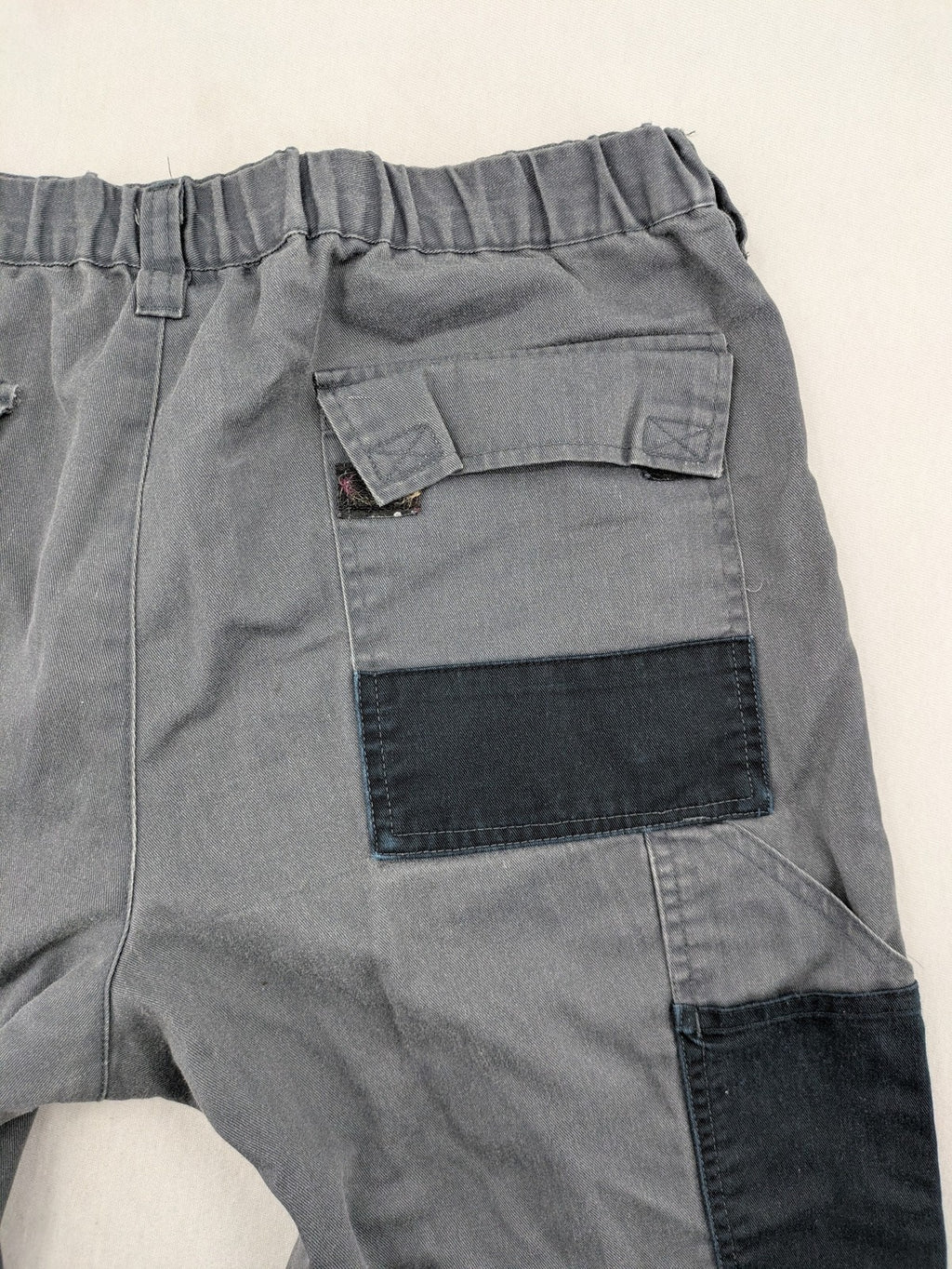 Watsons grey and black hunting tactical pants with Cordura reinforcements and elastic waistband.