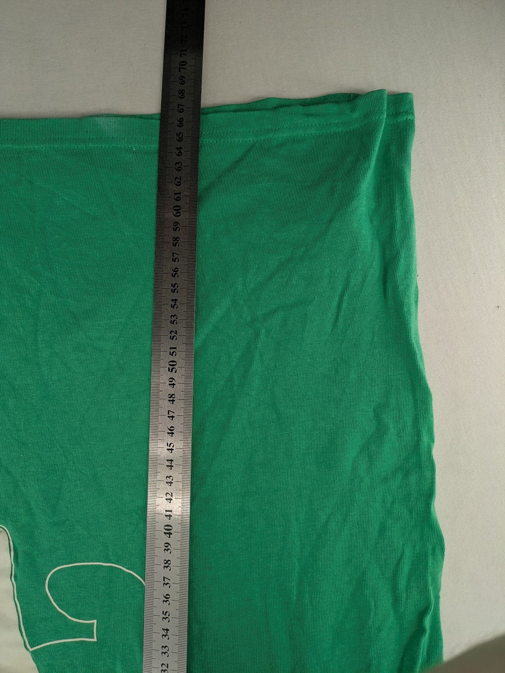 Myla green graphic t-shirt with large peace earth print and front pocket design.