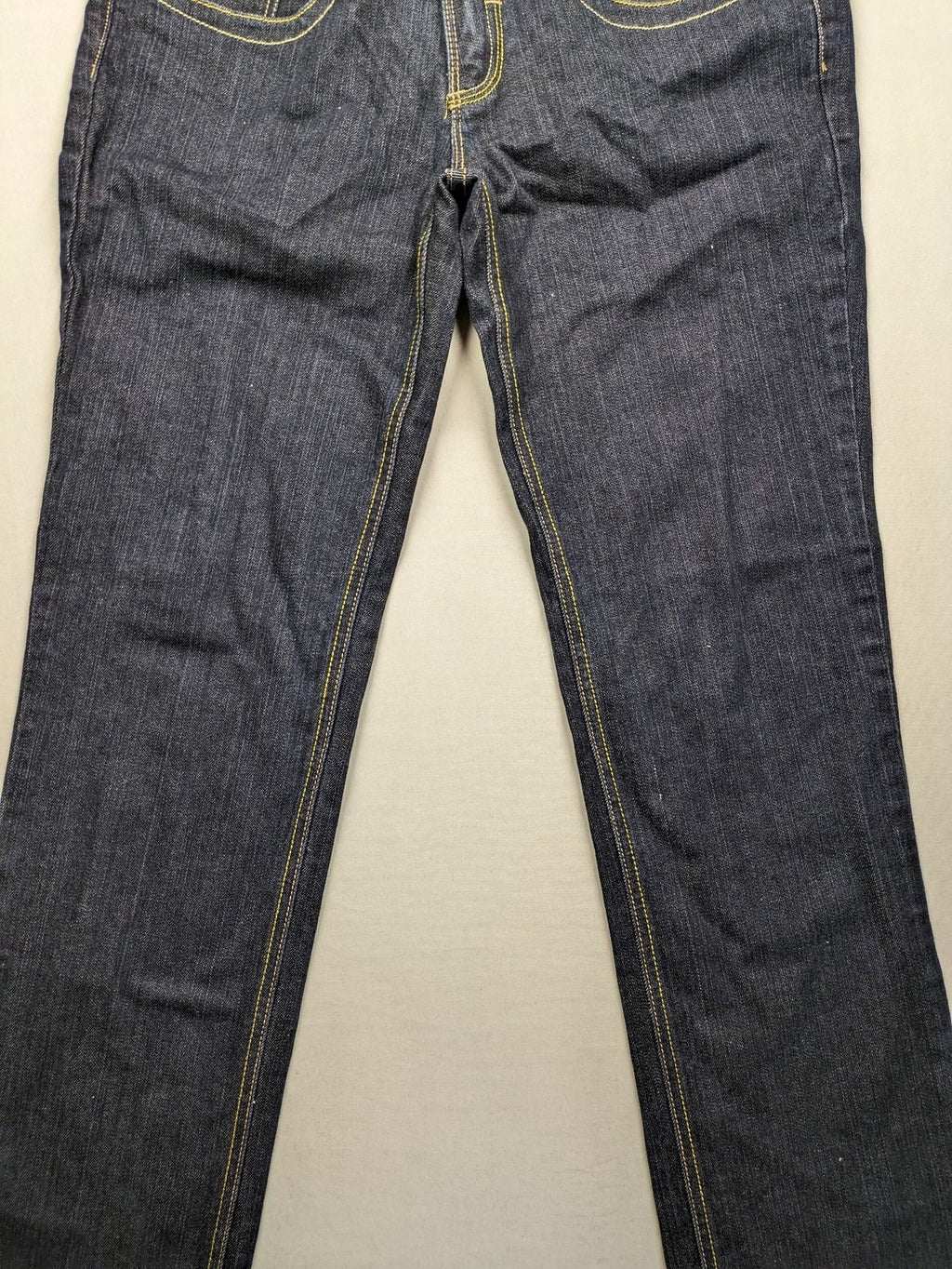 Furore blue straight jeans with yellow contrast stitching and zipper details.