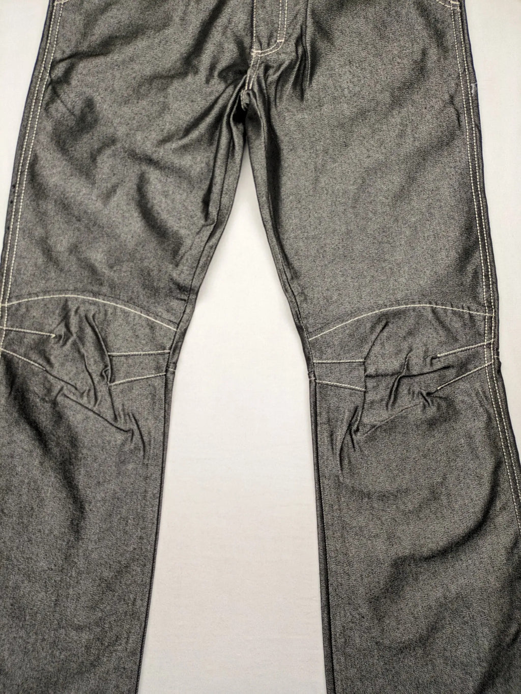 CIPO grey bootcut biker jeans with white contrast stitching and moto-inspired knee pleats.